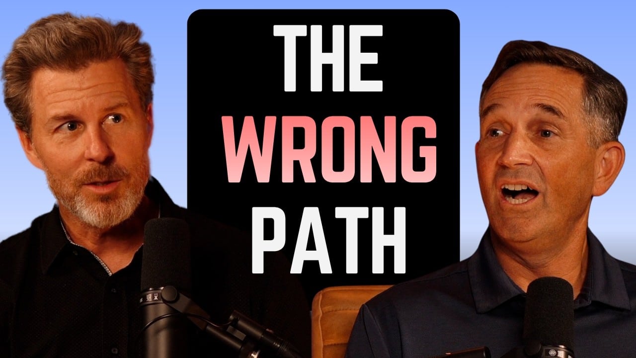 Two men on a podcast set with microphones and a central black panel reading THE WRONG PATH in pink letters against a blue gradient background.